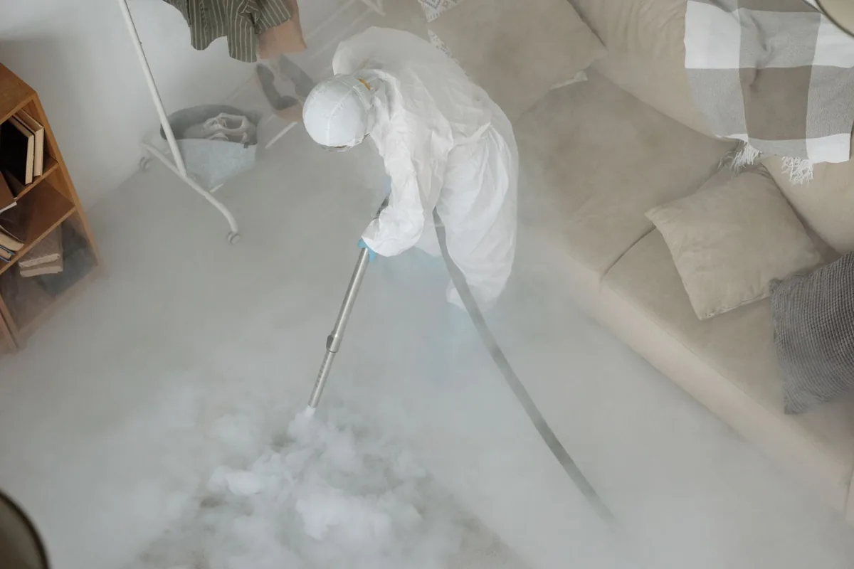 Biohazard cleanup technician in protective equipment, New Philadelphia, OH
